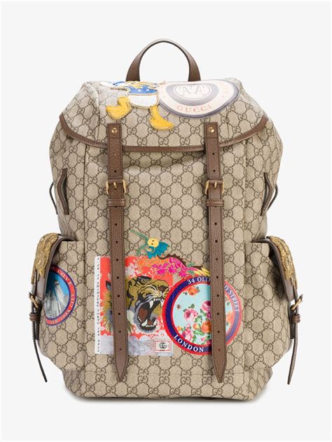 gucci gg supreme backpack with travel patches|Gucci supreme canvas backpack.